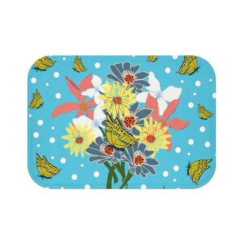 Mat with center bouquet of pink, yellow, white and light blue flowers, yellow and blue butterflies and white polka-dots on a tropical blue background.