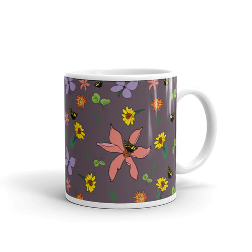 Purple Spring Flowers & Butterflies White glossy mug. Purple background, pink and yellow flowers, and green leaves.
